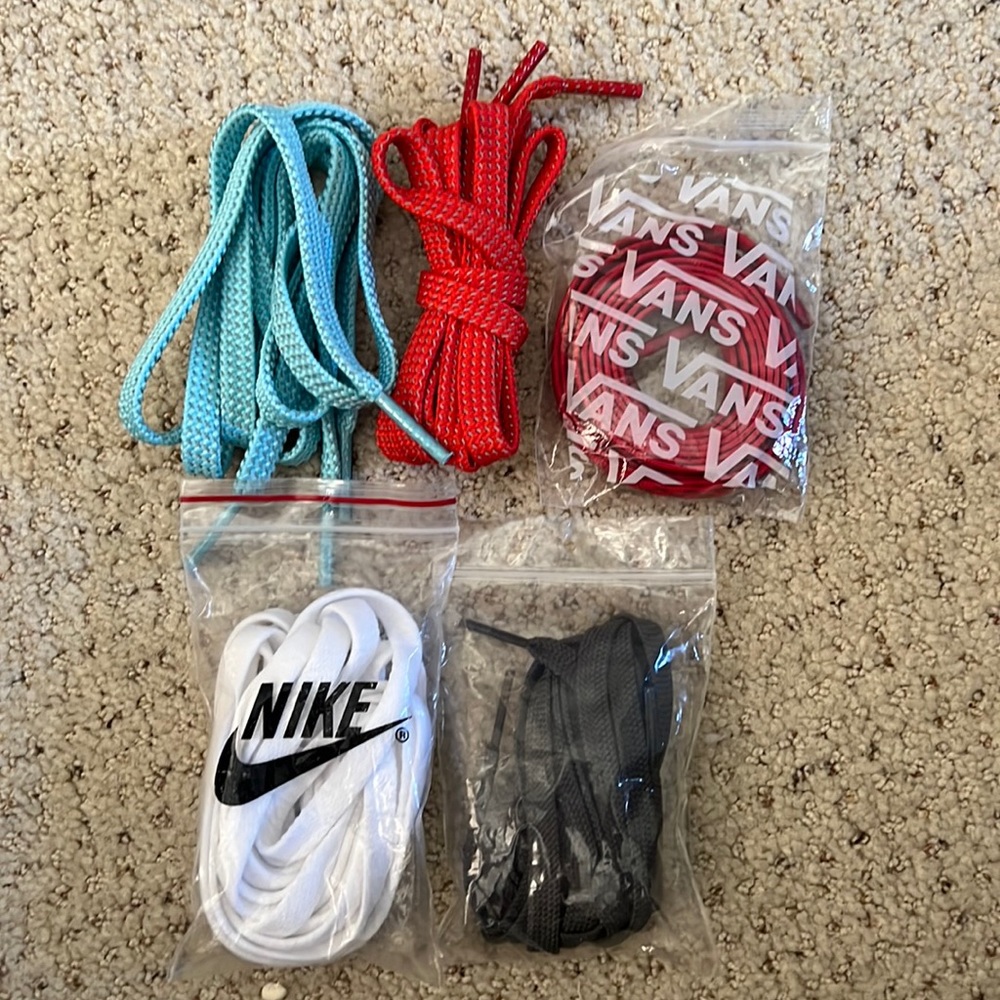 Lot of shoe laces including NOBULL, Nike, and Vans.